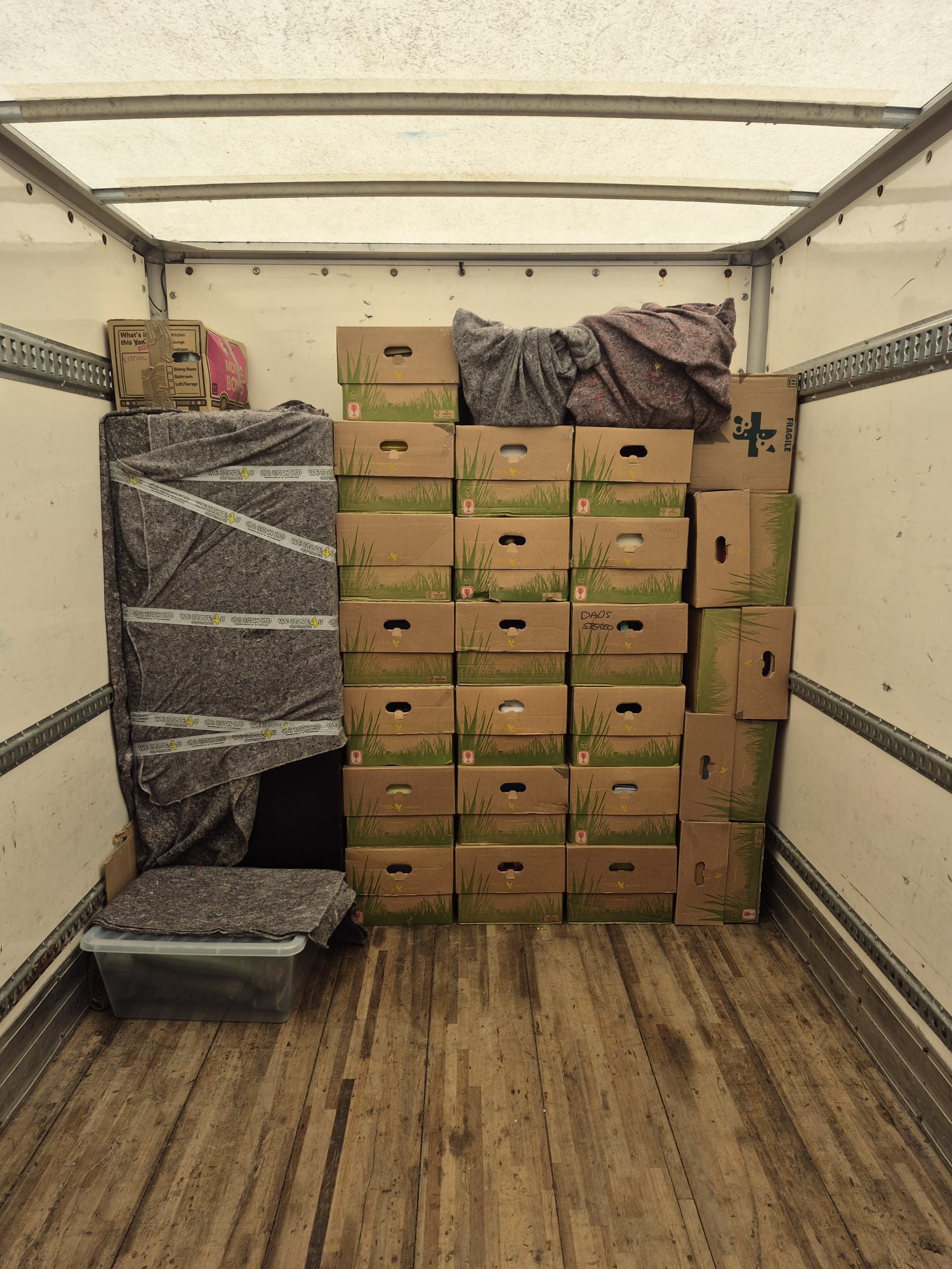 Packed boxes inside removal truck ready for international relocation